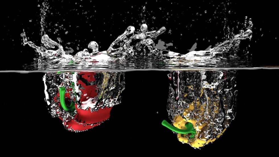 red and yellow pepper splashing into water